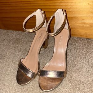 Metallic gold strapped heels